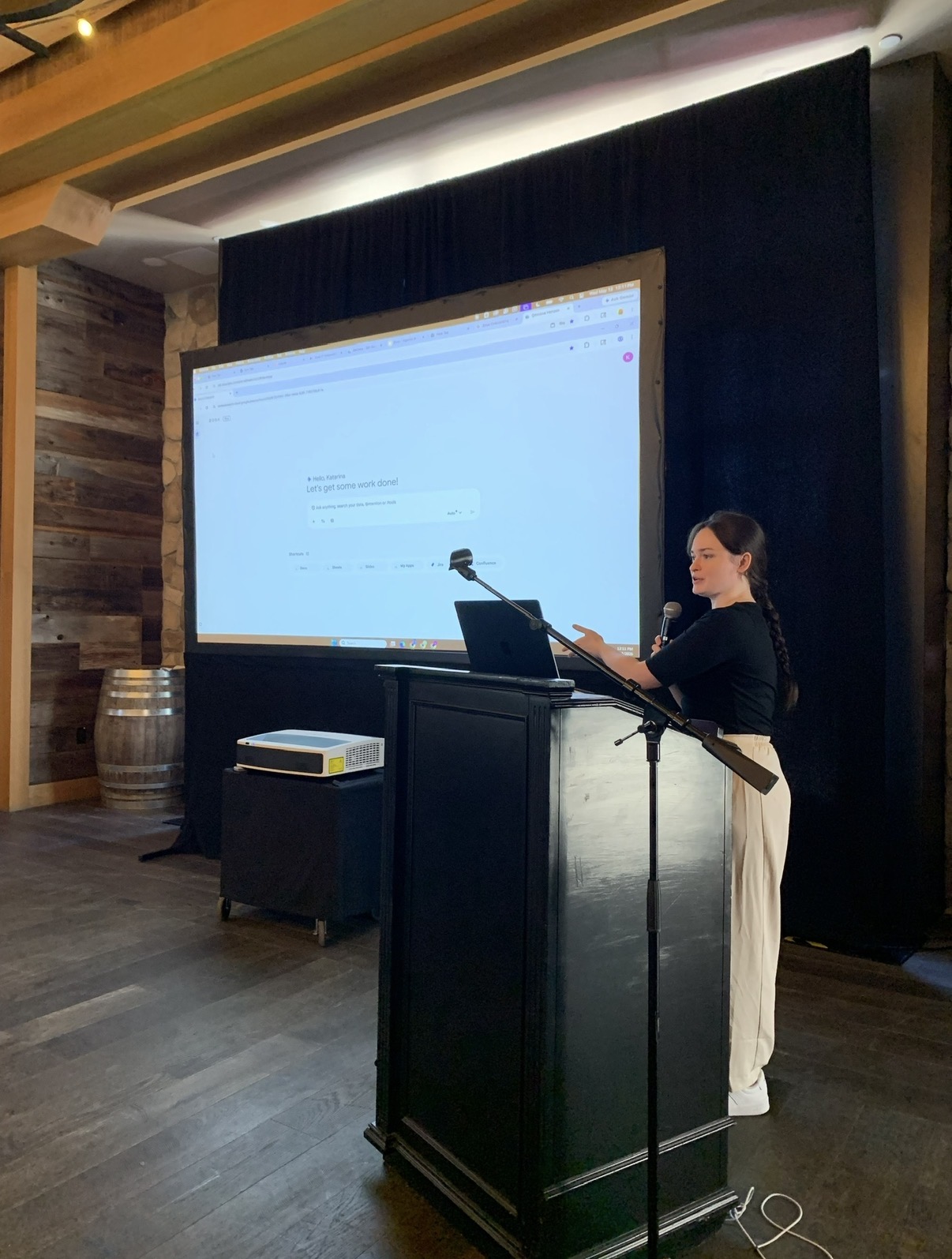 Kat presenting an AI workshop on stage