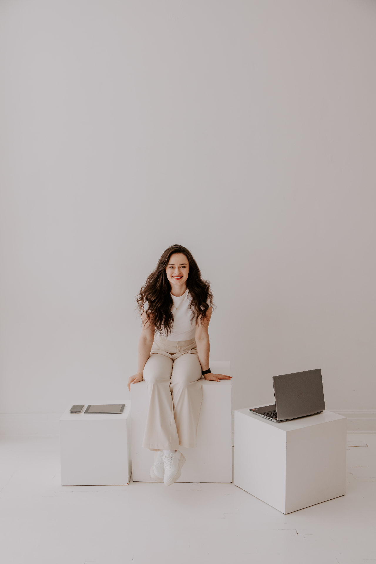 Kat in a bright white studio setting